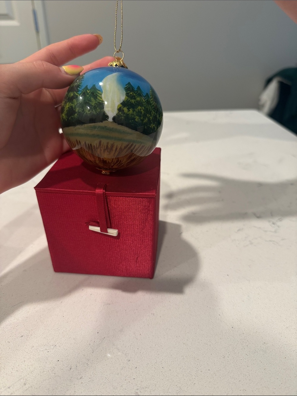 Yellowstone National Park Hand-Painted Blue Glass Ornament - Picture 2 of 3